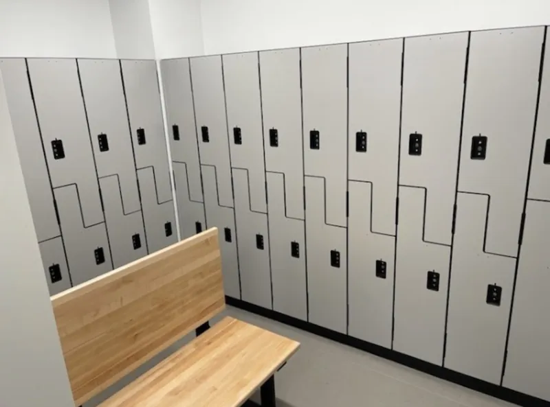 Two-tone locker banks with a wood changing bench