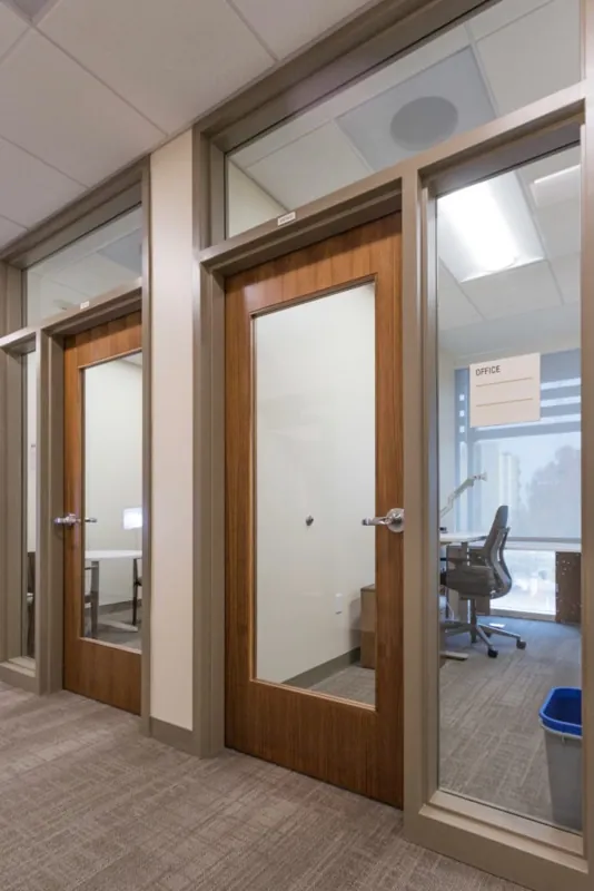 Glazed wood office doors with matching sidelites and transoms